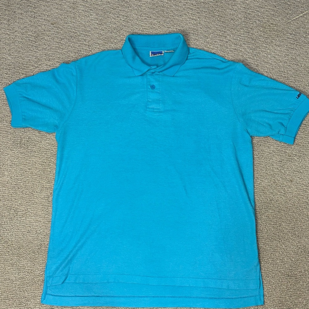 Vintage 1980s Levi's Men's Polo in a classic blue. Large.